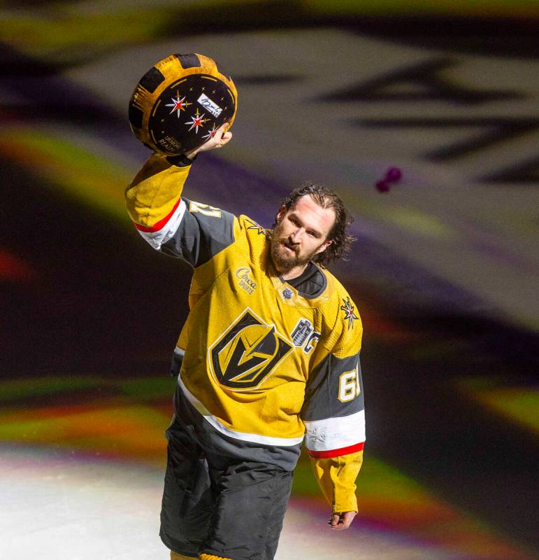 Golden Knights right wing Mark Stone (61) holds a giant puck to fans after defeating the Florid ...