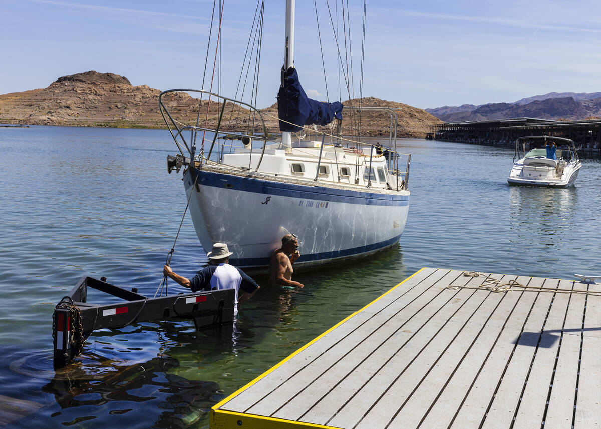 People prepare to take their boats out of the water at the Las Vegas Boat Harbor in the Lake Me ...