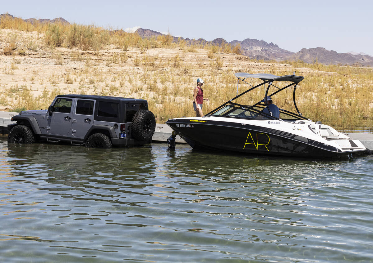 People prepare to take their boat out of the water at the Las Vegas Boat Harbor in the Lake Mea ...