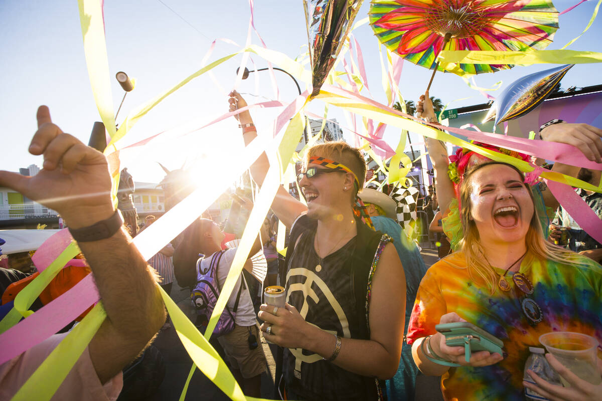 Attendees celebrate during a Pride Parade during day 2 of the Life is Beautiful festival in dow ...