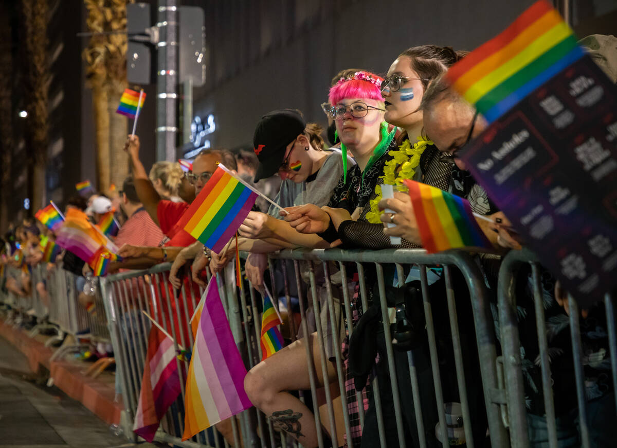 People watch the annual downtown Pride parade on Friday, Oct. 7, 2022, in Las Vegas. (Amaya Edw ...