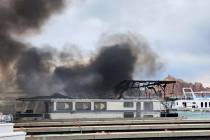 This photo shows smoke rising from a fire on Friday, June 2, 2023, at Wahweap Marina on Lake Po ...