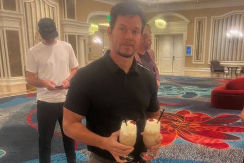 Mark Wahlberg double-fists milkshakes at the Bellagio during his visit to employee orientation ...