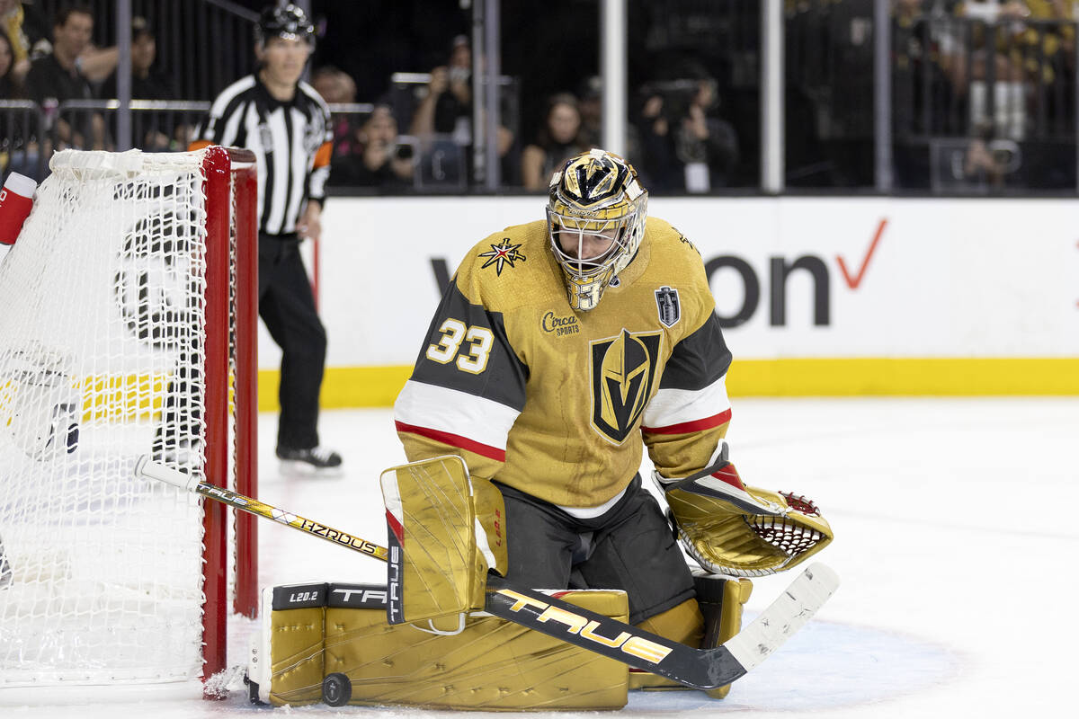 Golden Knights goaltender Adin Hill (33) saves the puck during the second period in Game 1 of t ...