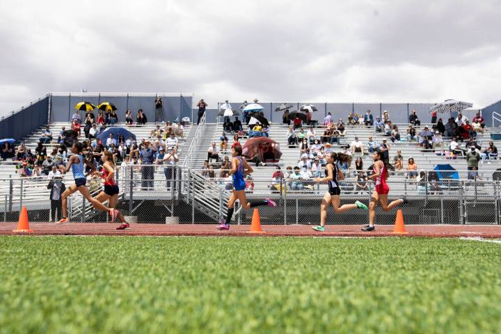 Runners compete in the girls 400 meter dash during the class 5A Southern Region boys and girls ...