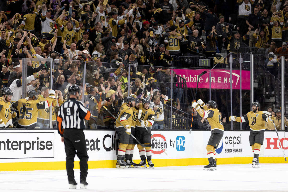 The Golden Knights celebrate after defenseman Shea Theodore (27) scored during the second perio ...