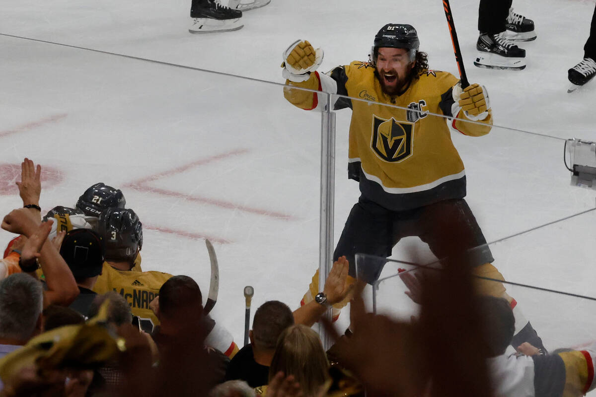 Golden Knights right wing Mark Stone (61) reacts after defenseman Shea Theodore (27) scored a g ...