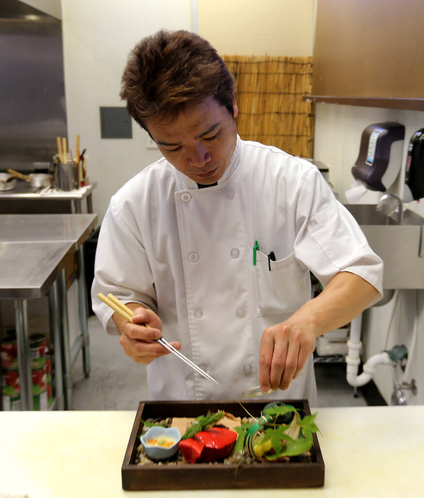 Chef Kaoru Azeuchi works on the Hassun at Kaiseki Yuzu in Las Vegas in May 2018. (K.M. Cannon L ...