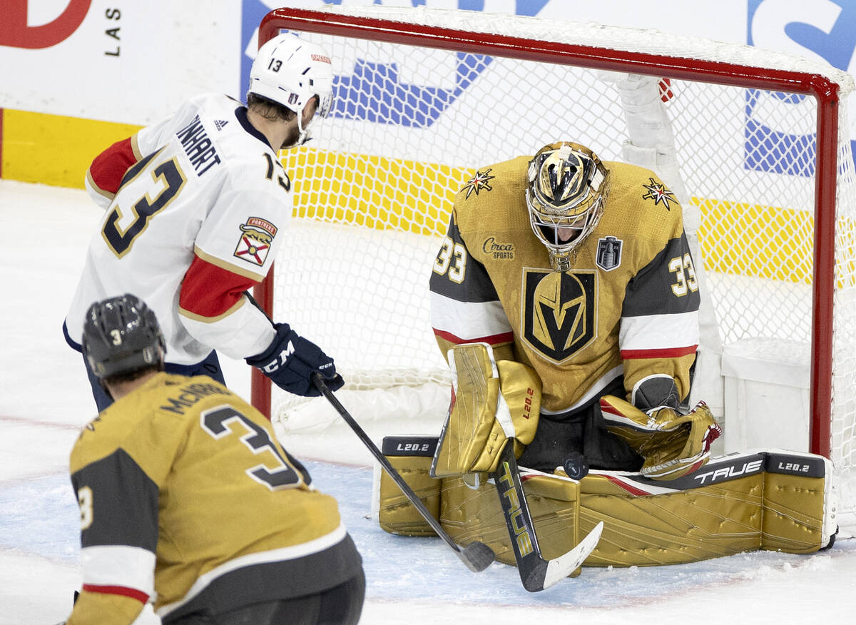 Golden Knights goaltender Adin Hill (33) saves the puck against Florida Panthers center Sam Rei ...