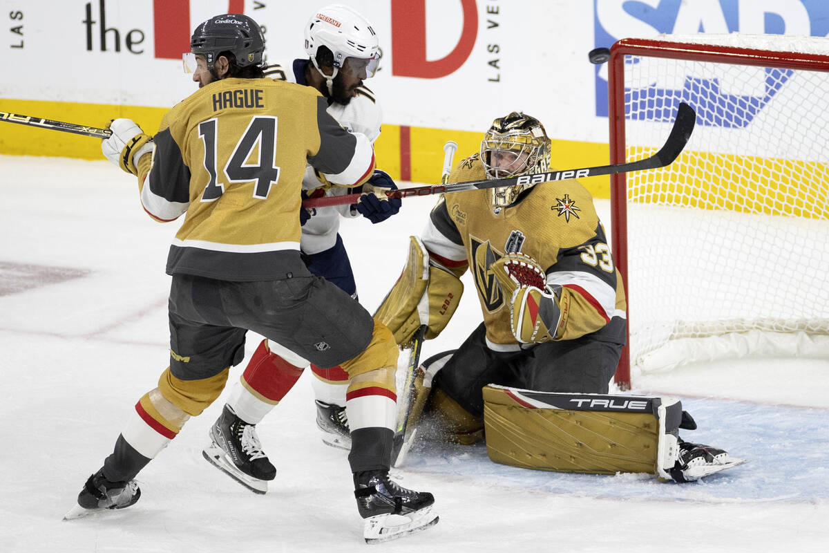 Golden Knights goaltender Adin Hill (33) saves the puck against Florida Panthers left wing Anth ...