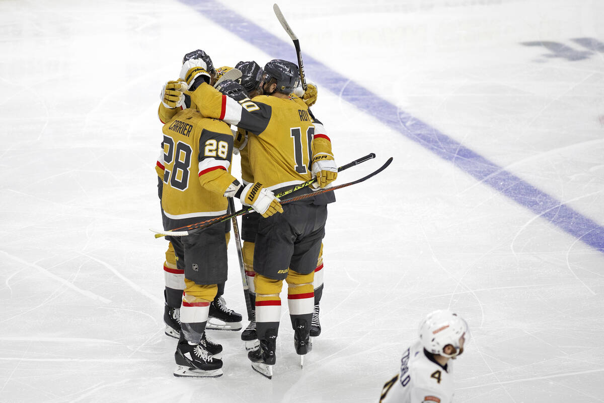 The Golden Knights celebrate after center Nicolas Roy (10) scored on the Florida Panthers durin ...