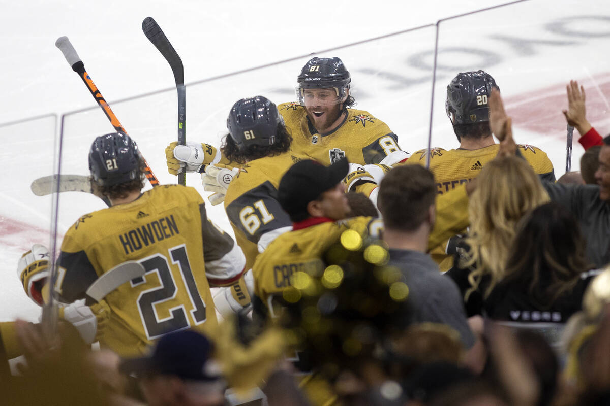 Golden Knights right wing Jonathan Marchessault (81) receives congratulations from the bench af ...