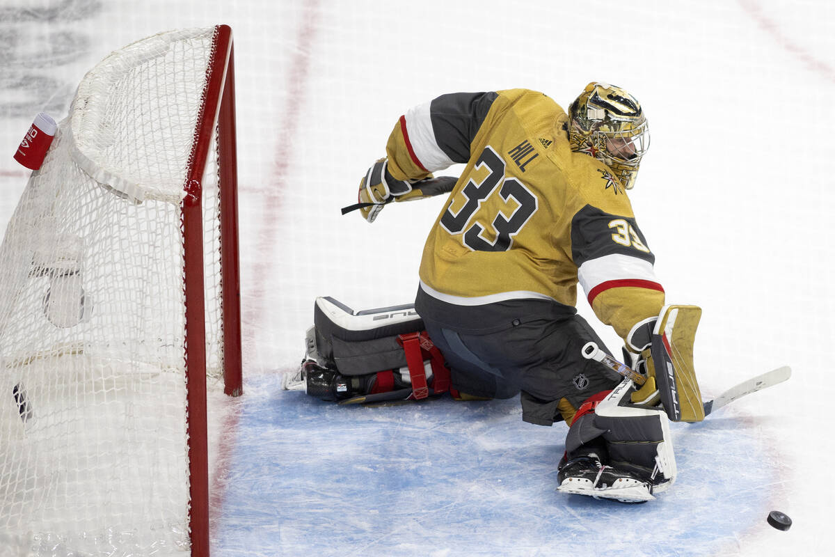 Golden Knights goaltender Adin Hill (33) saves the puck during the third period in Game 2 of th ...