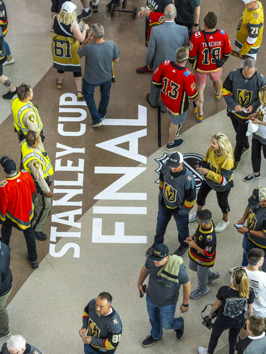 Fans stream into the arena in Toshiba Plaza before Game 2 of the NHL hockey Stanley Cup Final s ...