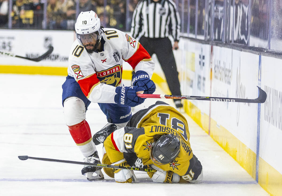 Florida Panthers left wing Anthony Duclair (10) drives Golden Knights right wing Jonathan March ...
