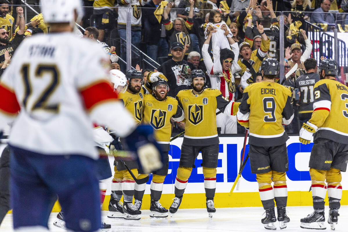 Golden Knights players celebrate another goal against the Florida Panthers in the third period ...