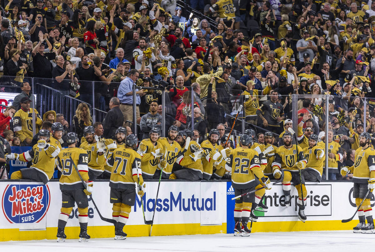 Golden Knights players celebrate another goal against the Florida Panthers in the third period ...