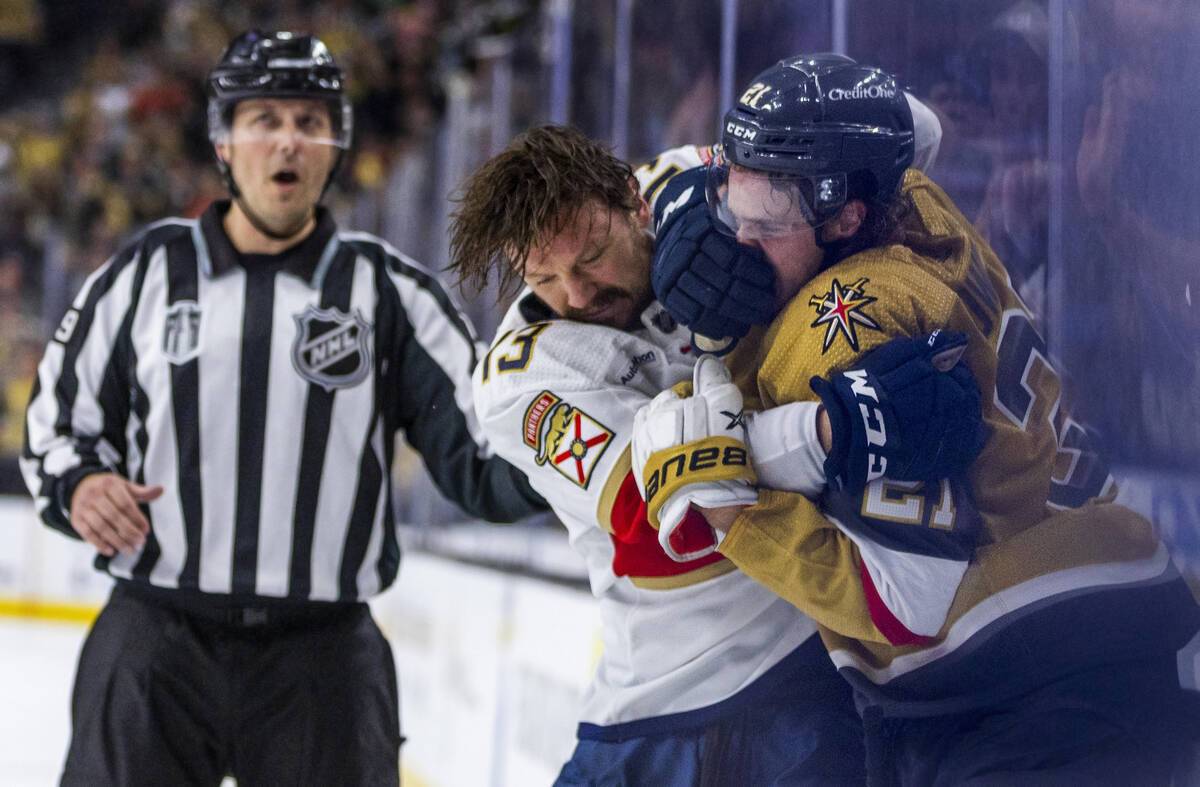 Florida Panthers center Sam Reinhart (13) and Golden Knights center Brett Howden (21) fight aga ...