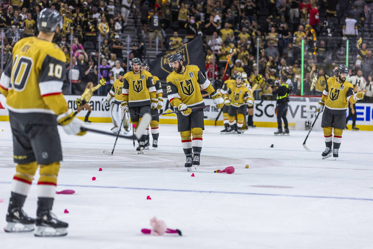 Golden Knights players hit flamingos tossed into the ice after defeating the Florida Panthers 7 ...