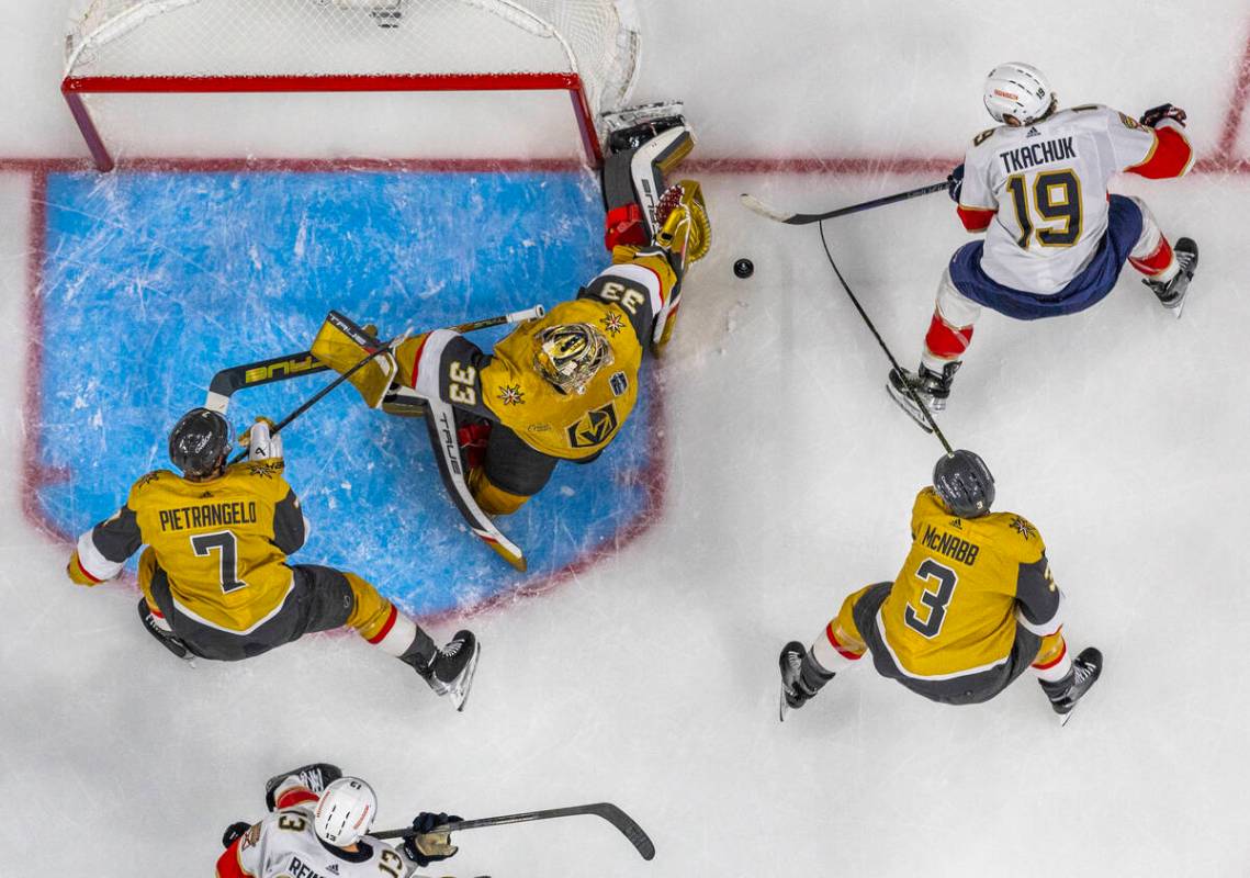 Golden Knights goaltender Adin Hill (33) rejects a shot by Florida Panthers left wing Matthew T ...