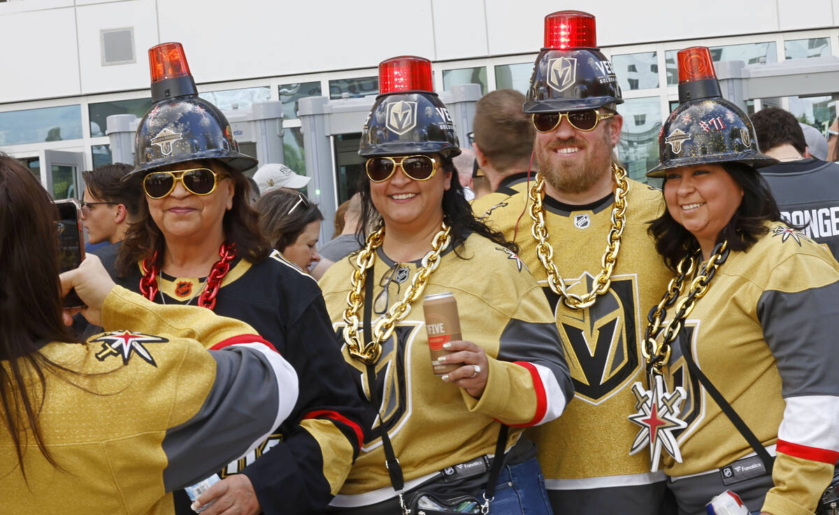 Golden Knights fans Cindy Haller of Golden Valley Ariz., from left, her daughter Carlie MacArth ...