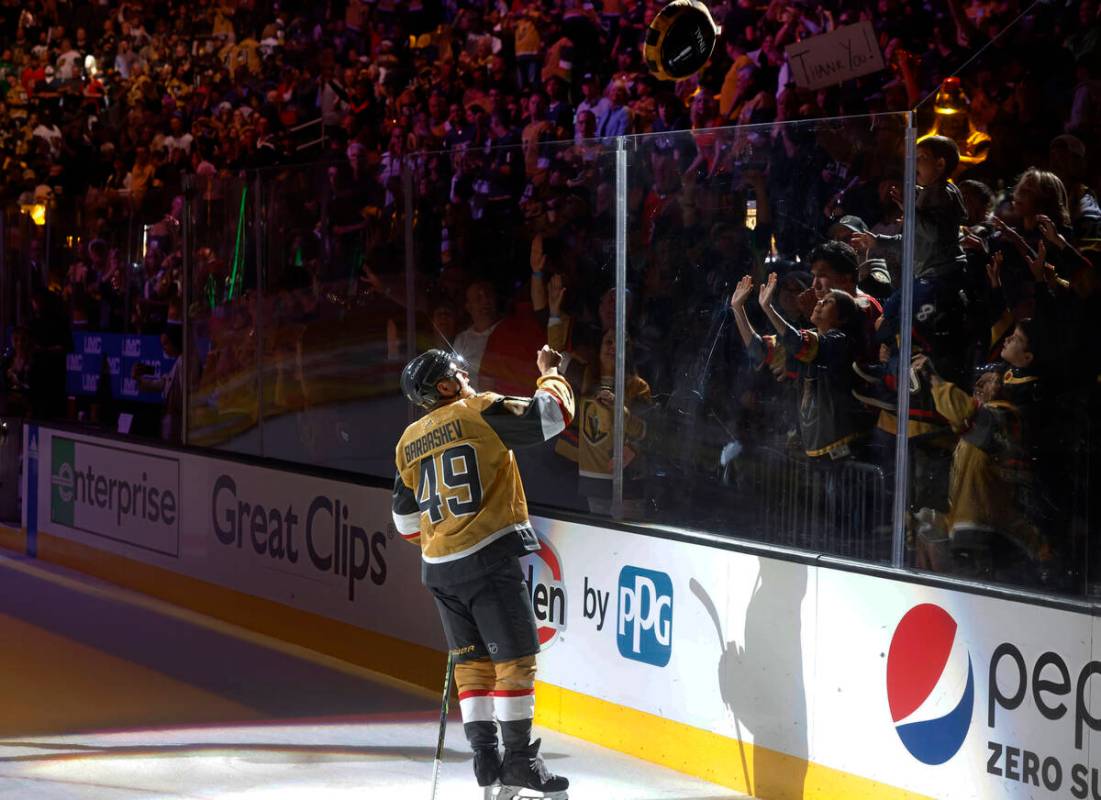 Golden Knights center Ivan Barbashev (49) tosses a giant puck to fans after their 7-2 victory a ...