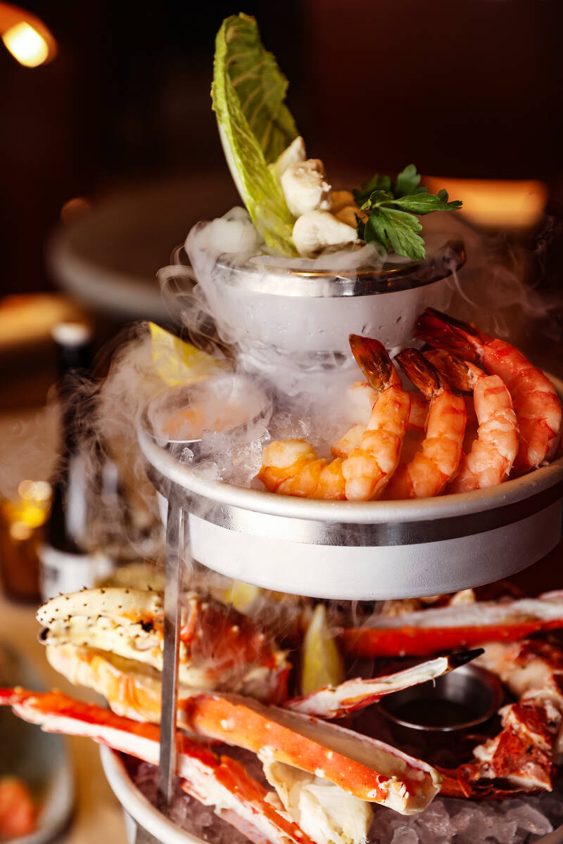 The Smoking Shellfish Tower, a custom built tower of mixed seafood, at Ocean Prime, an upscale ...