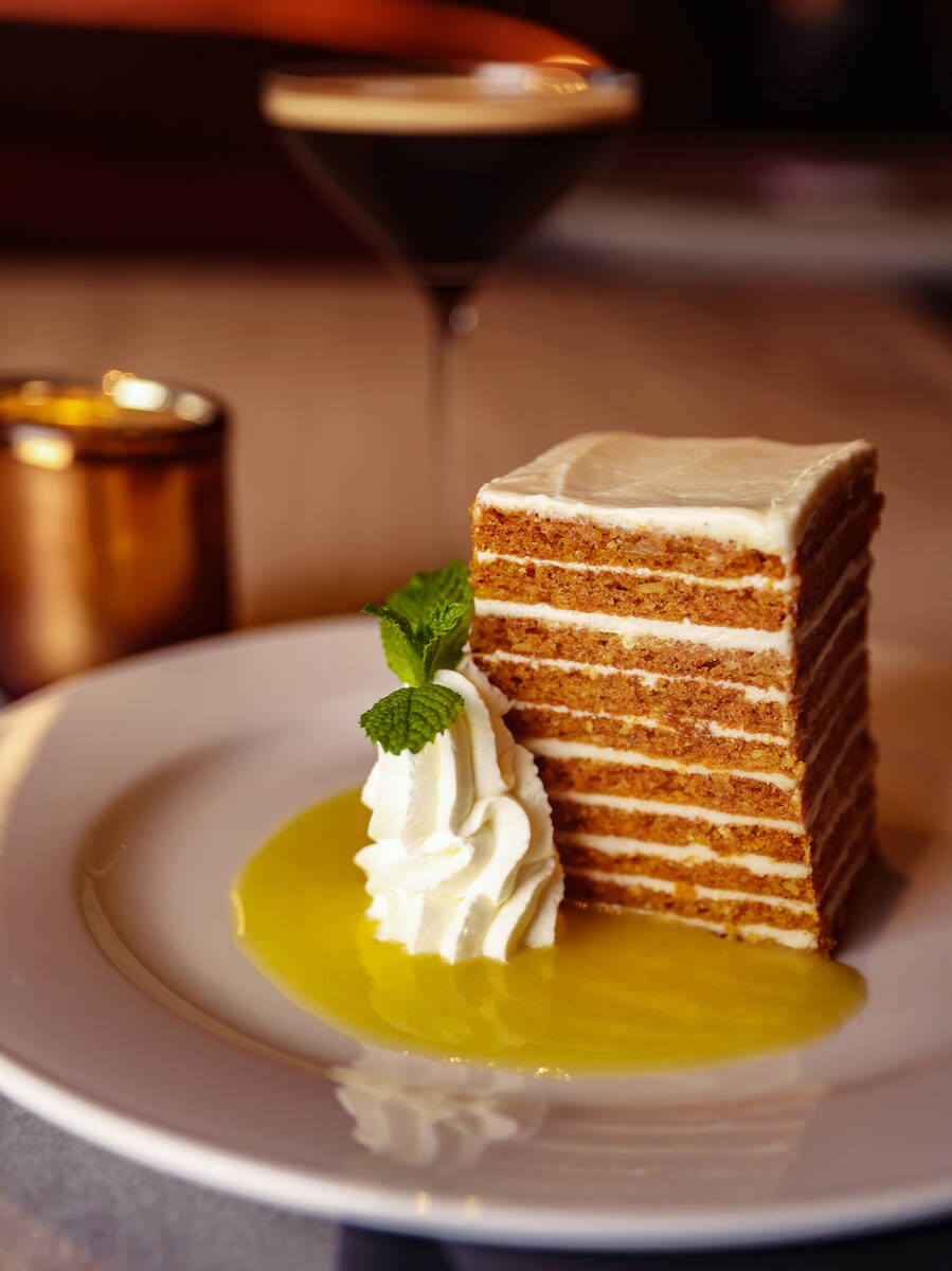 The Ten Layer Carrot Cake, made with cream cheese icing and pineapple syrup, at Ocean Prime, an ...