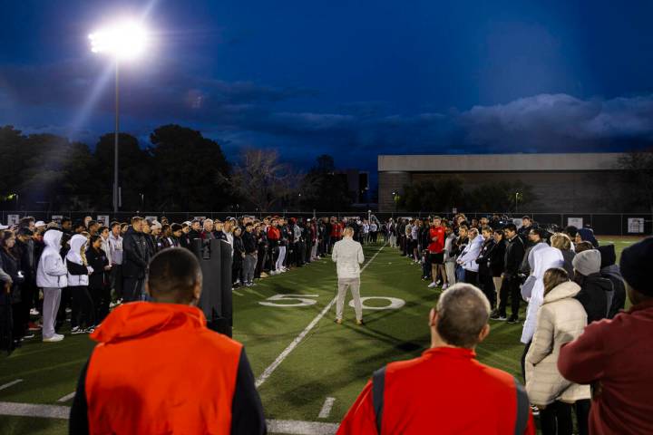 People gather on the 47-yard lines on the field at Rebel Park at the Fertitta Football Complex ...