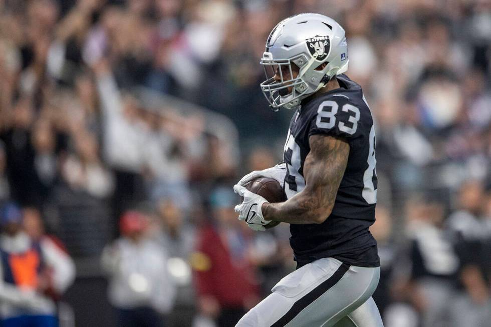Raiders tight end Darren Waller (83) scores a touchdown during the first half of an NFL game ag ...