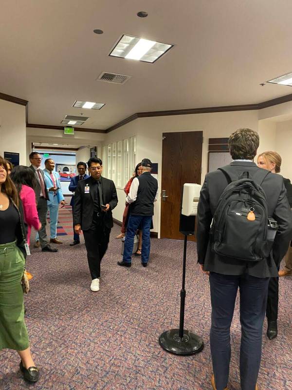 Lawmakers and lobbyists gather outside of a committee room in the Nevada Legislature building o ...