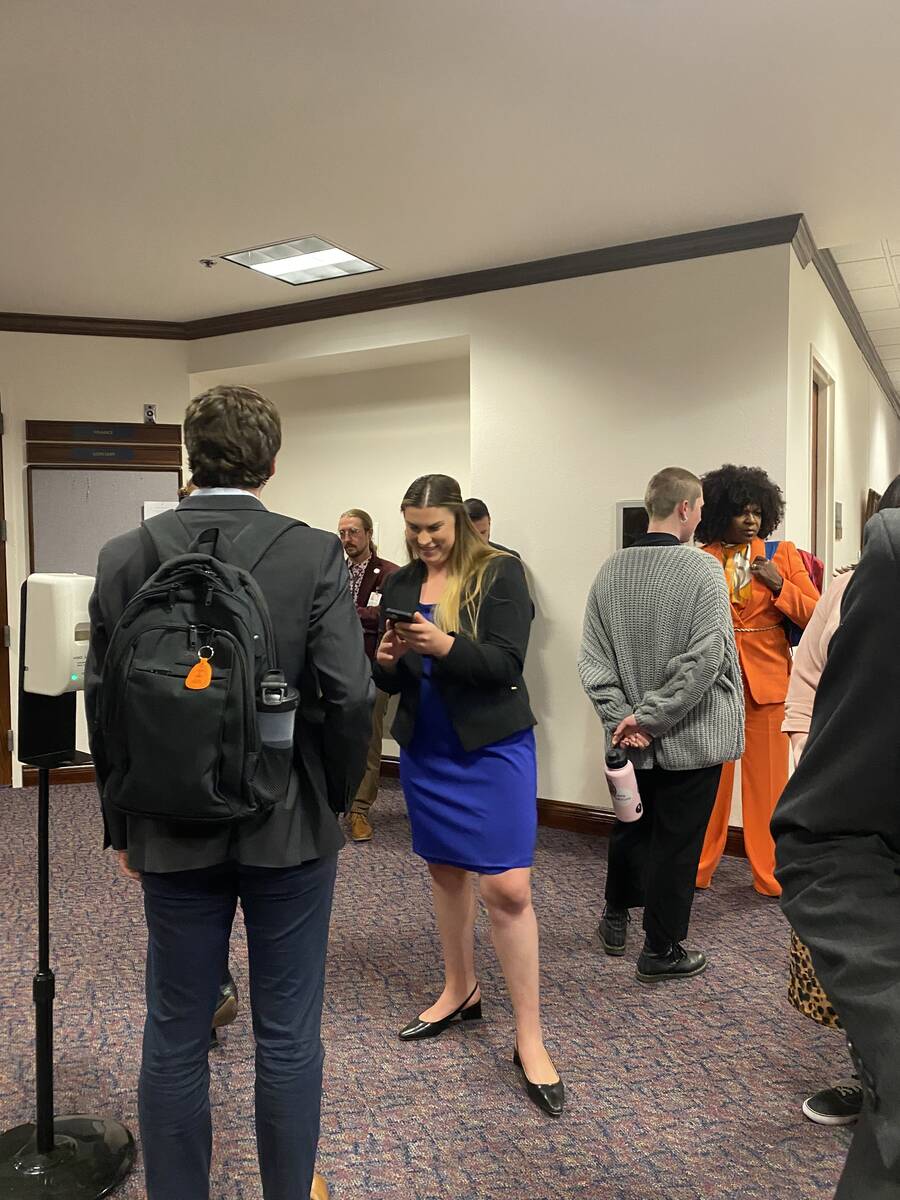 Lawmakers and lobbyists gather outside of a committee room in the Nevada Legislature building o ...
