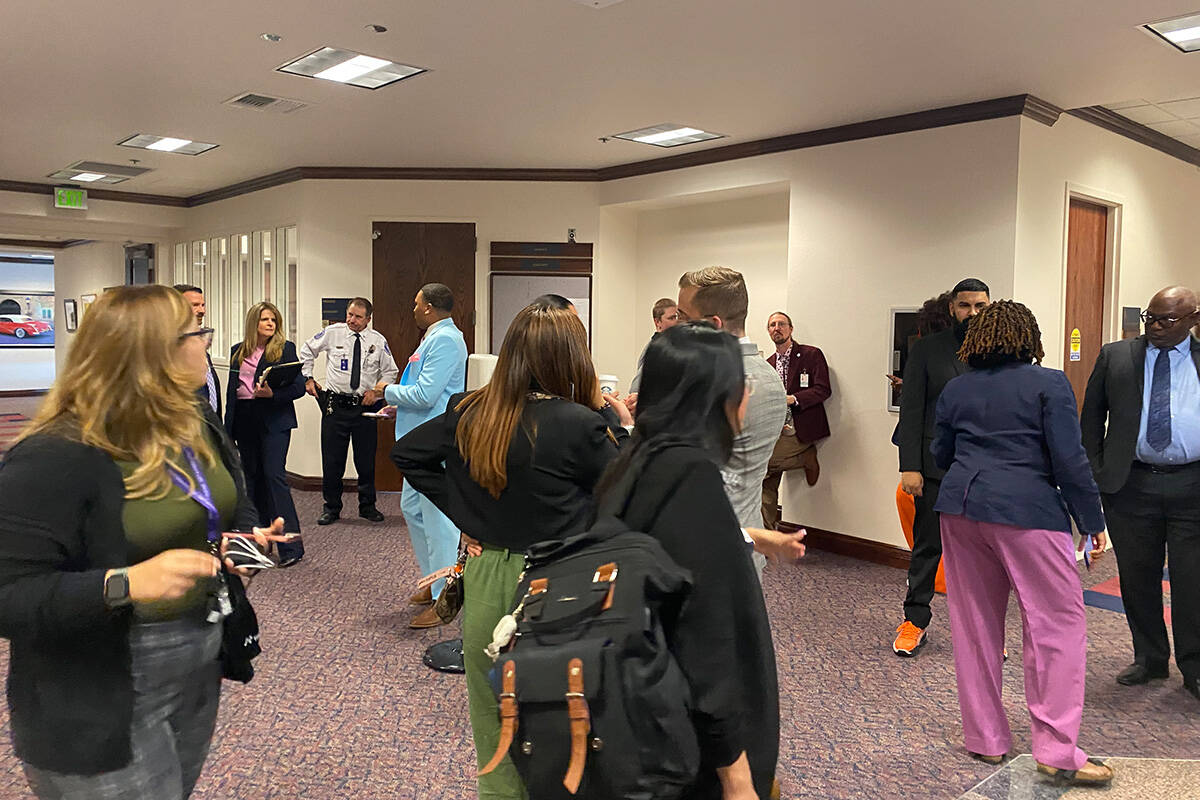 Lawmakers and lobbyists gather outside of a committee room in the Nevada Legislature building o ...