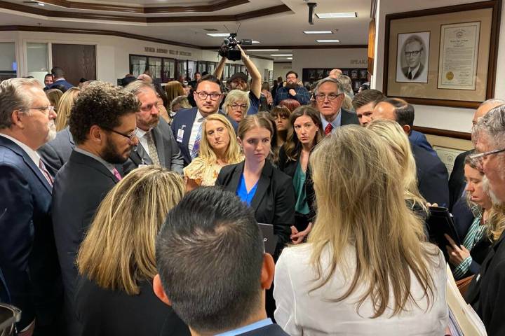 Lawmakers, lobbyists and members of the press gather in the Nevada Legislature building for a c ...