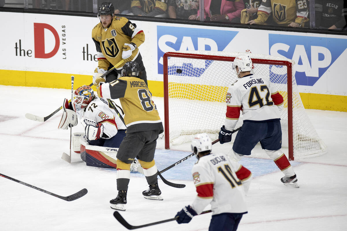Golden Knights defenseman Alec Martinez, out of frame at left, scores on Florida Panthers goalt ...
