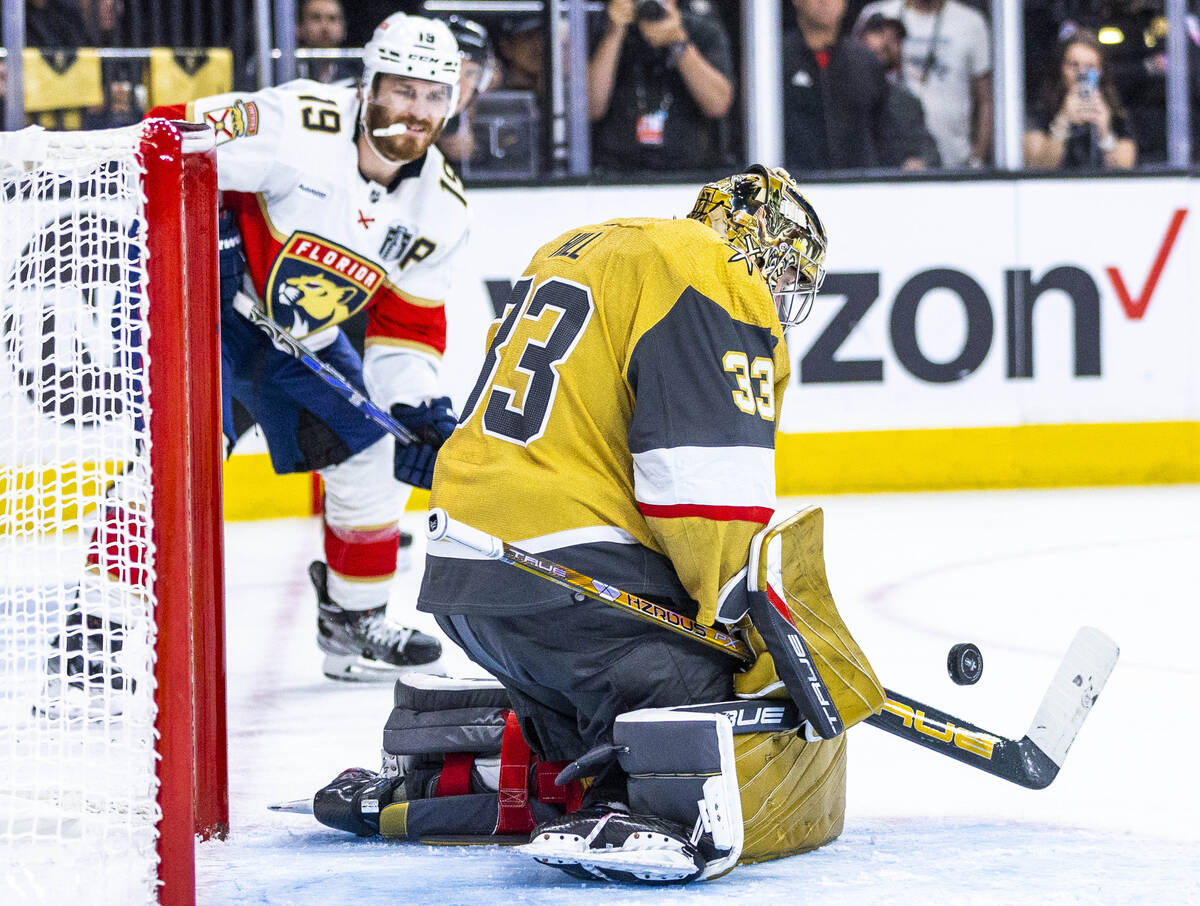 Golden Knights goaltender Adin Hill (33) deflects another shot as Florida Panthers left wing Ma ...