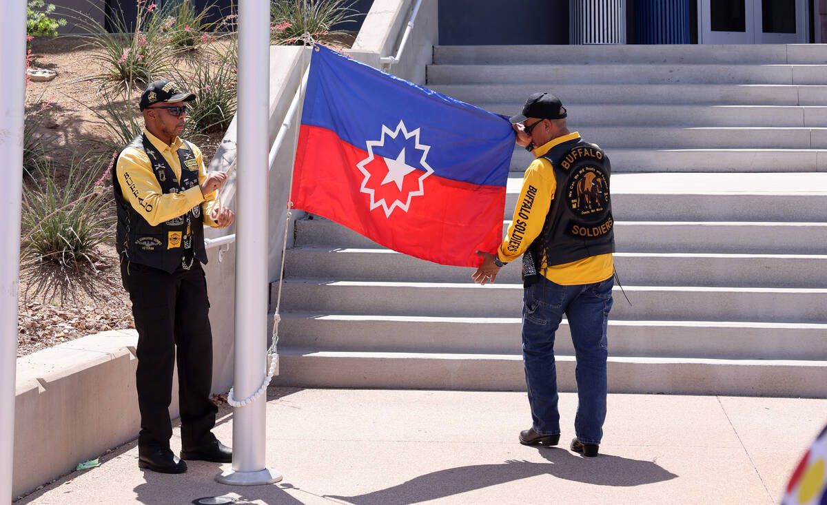 Will Witt, left, and Dave McKinney with Buffalo Soldiers Motorcycle Club Las Vegas Post raise t ...