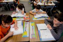 FILE - Student's in Amy Bennett's third-grade classroom work on mathematics at Vanderburg Eleme ...