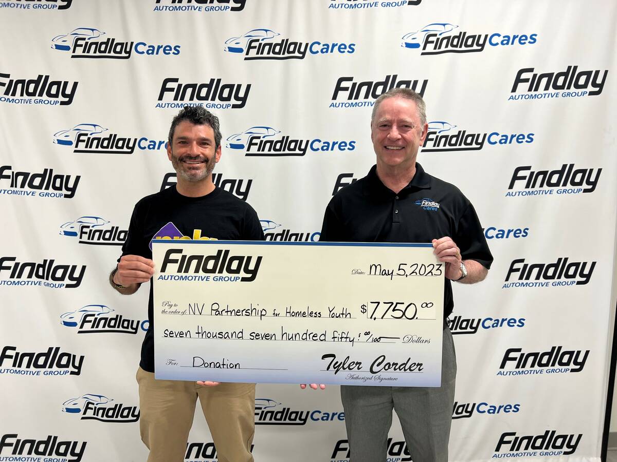 Tyler Corder, right, and Arash Ghafoori celebrate the partnership between Findlay Automotive an ...