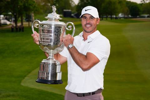 Brooks Koepka holds the Wanamaker trophy after winning the PGA Championship golf tournament at ...