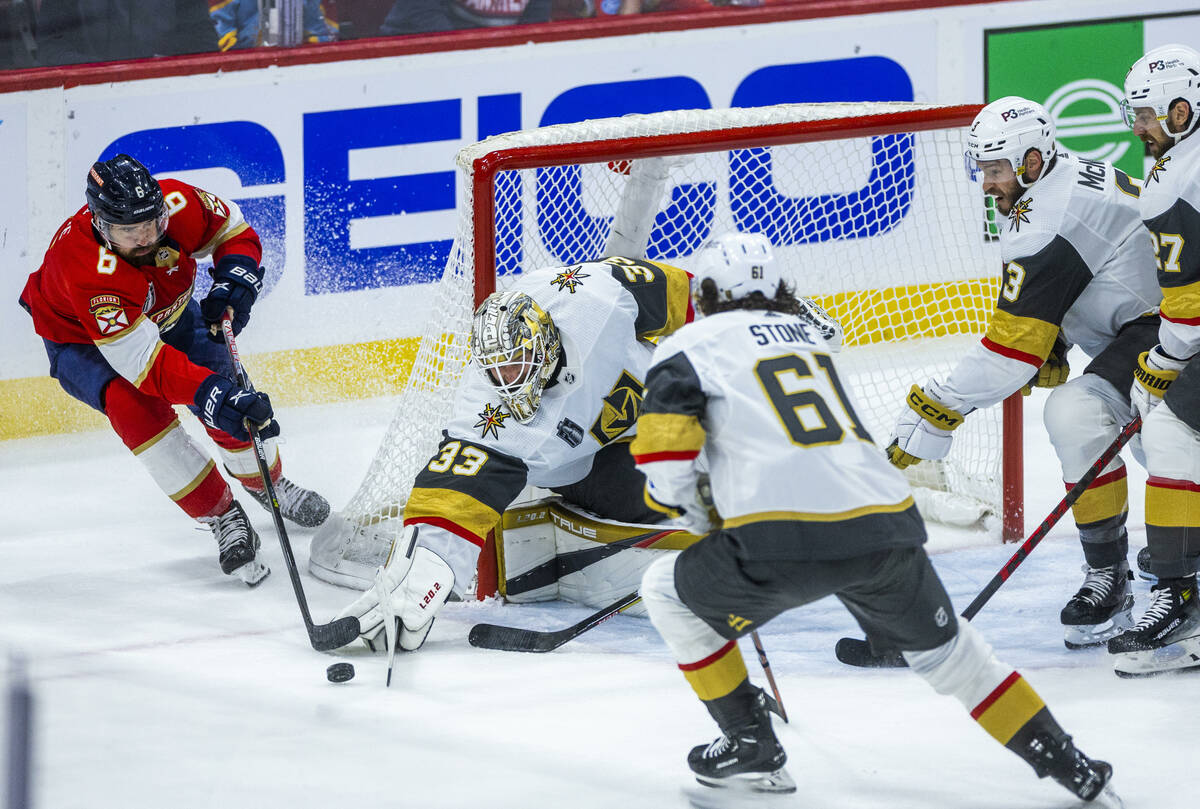 Golden Knights goaltender Adin Hill (33) deflects a shot attempt by Florida Panthers center Col ...