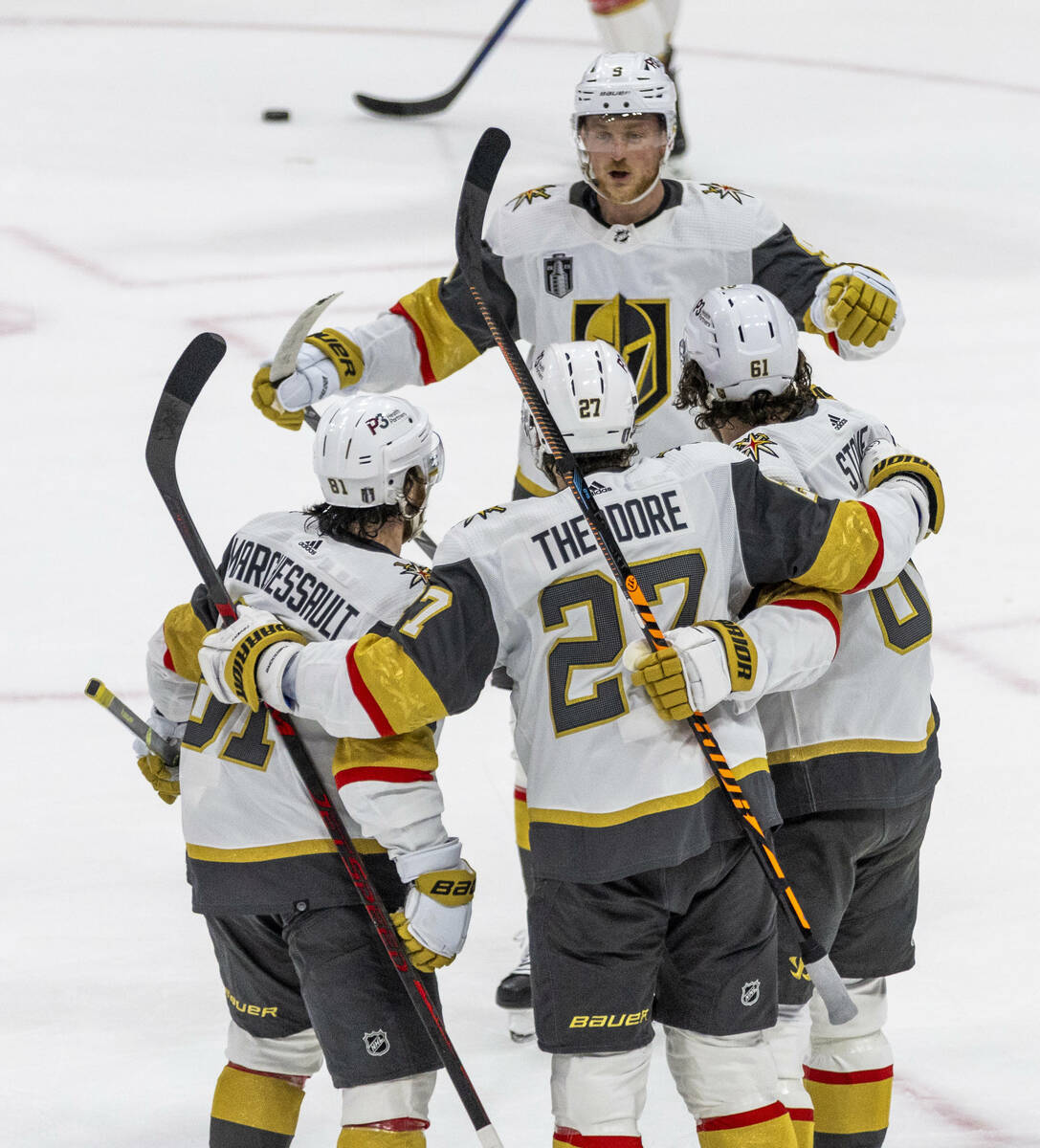 Golden Knights players celebrate a score on Florida Panthers goaltender Sergei Bobrovsky (72) i ...