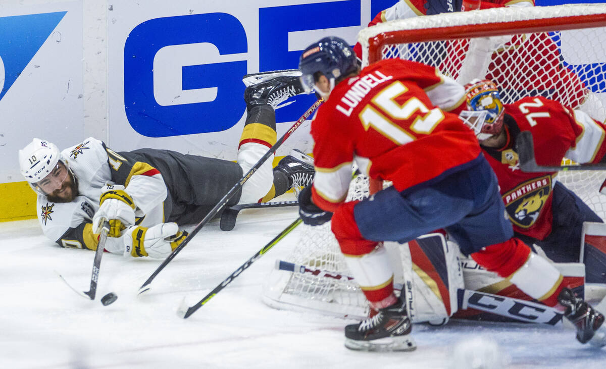 Golden Knights center Nicolas Roy (10) attempts to pass from the ice past Florida Panthers cent ...
