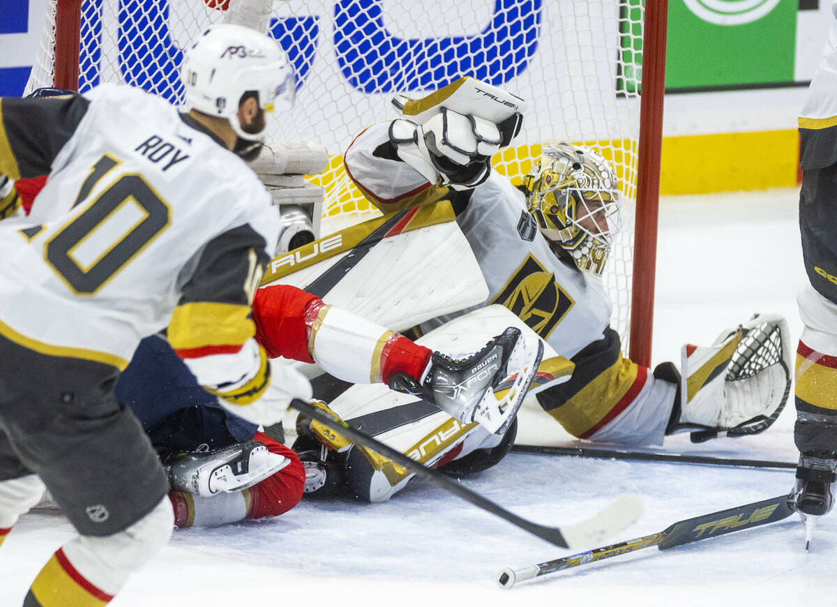 Golden Knights goaltender Adin Hill (33) dives to make another save against the Florida Panther ...