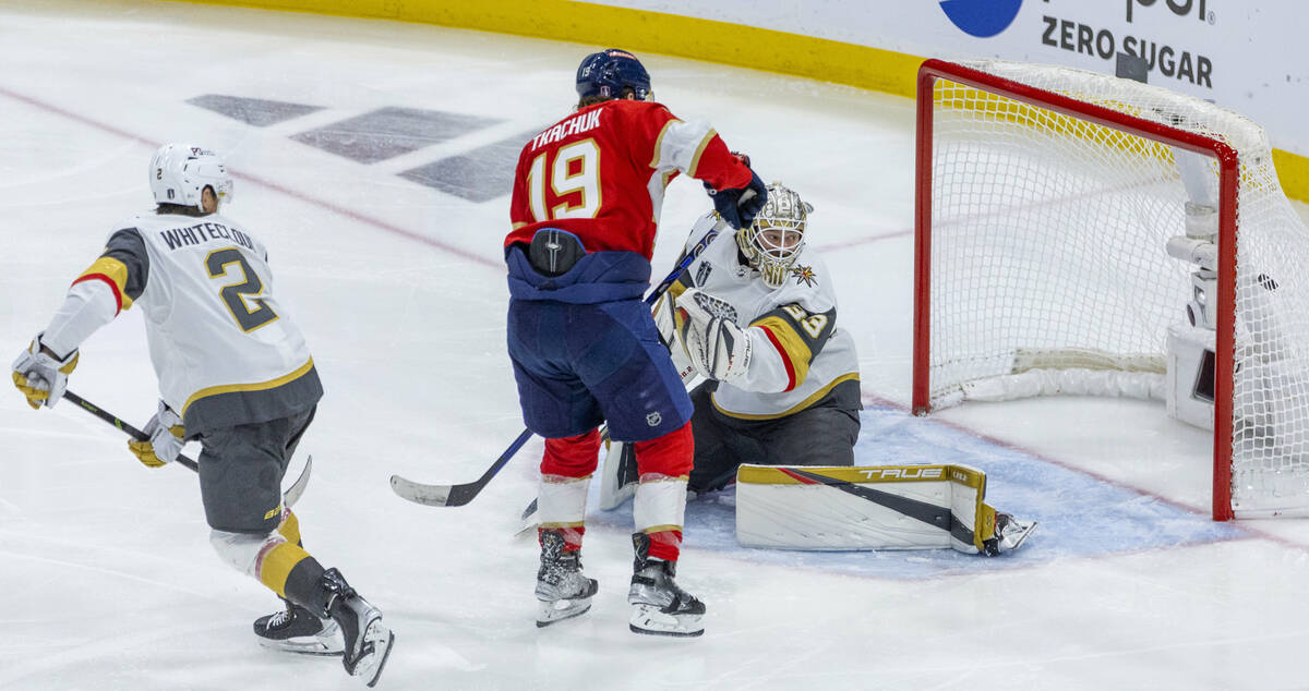 Golden Knights goaltender Adin Hill (33) looks back as a goal hits the net with Florida Panther ...