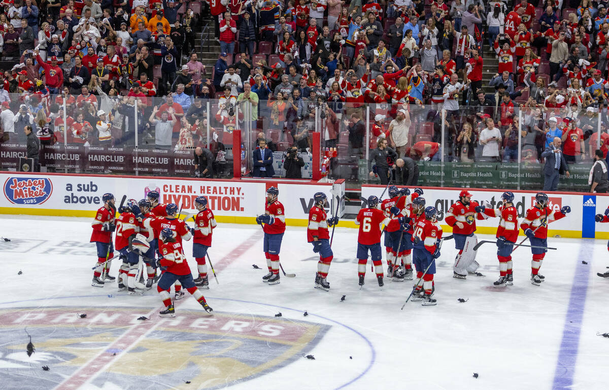 Florida Panthers players celebrate with rats on the ice after defeating the Golden Knights 3-2 ...