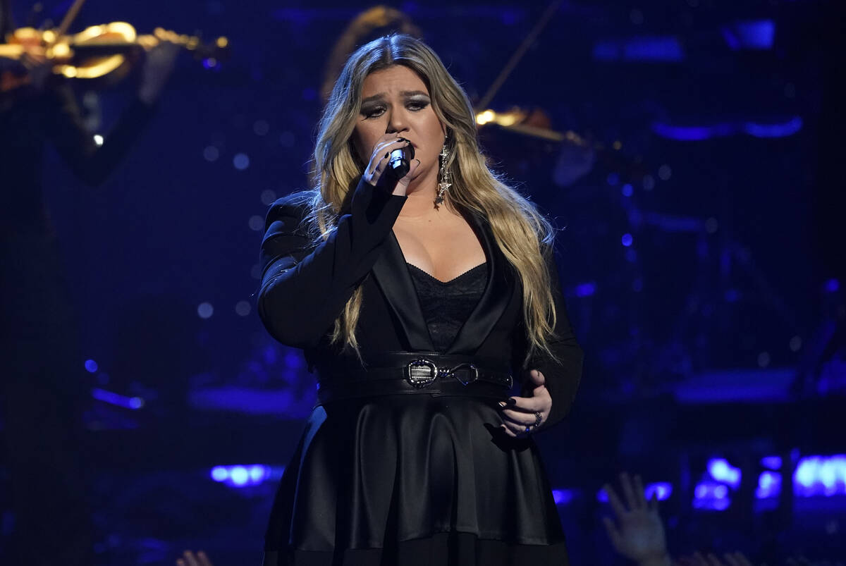 FILE - Kelly Clarkson performs during a tribute to Icon award winner Pink at the iHeartRadio Mu ...