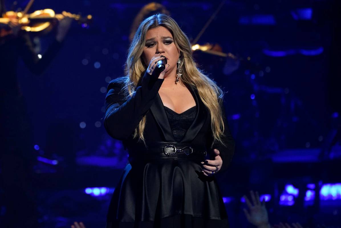 FILE - Kelly Clarkson performs during a tribute to Icon award winner Pink at the iHeartRadio Mu ...