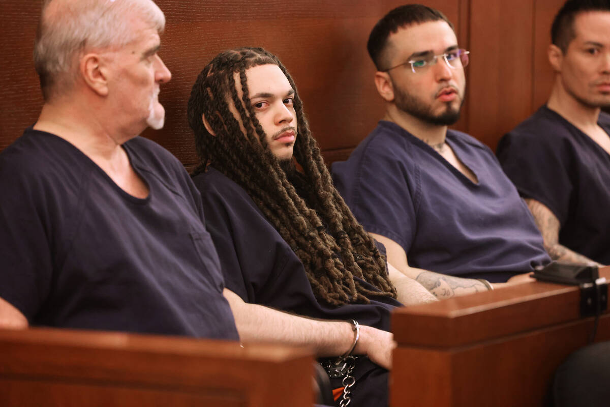 Jcahoyl Ducksworth, who pleaded guilty to second degree murder, second from left, waits in cour ...