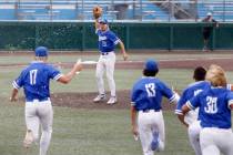 Bishop Gorman's Aiden Pollock (23) celebrates with his teammates after beating Desert Oasis in ...